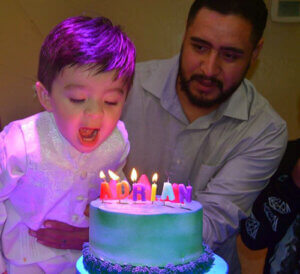Jose Rocha and his son celebrate a birthday.