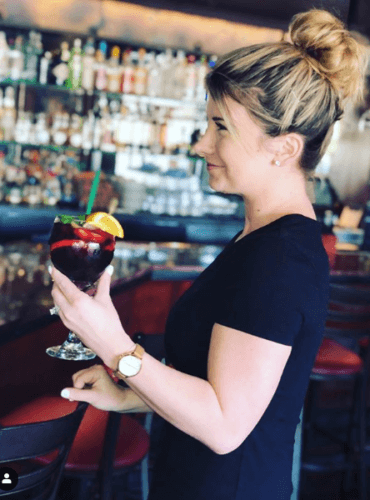 The server serving a drink at the Phoenix City Grille Bar.