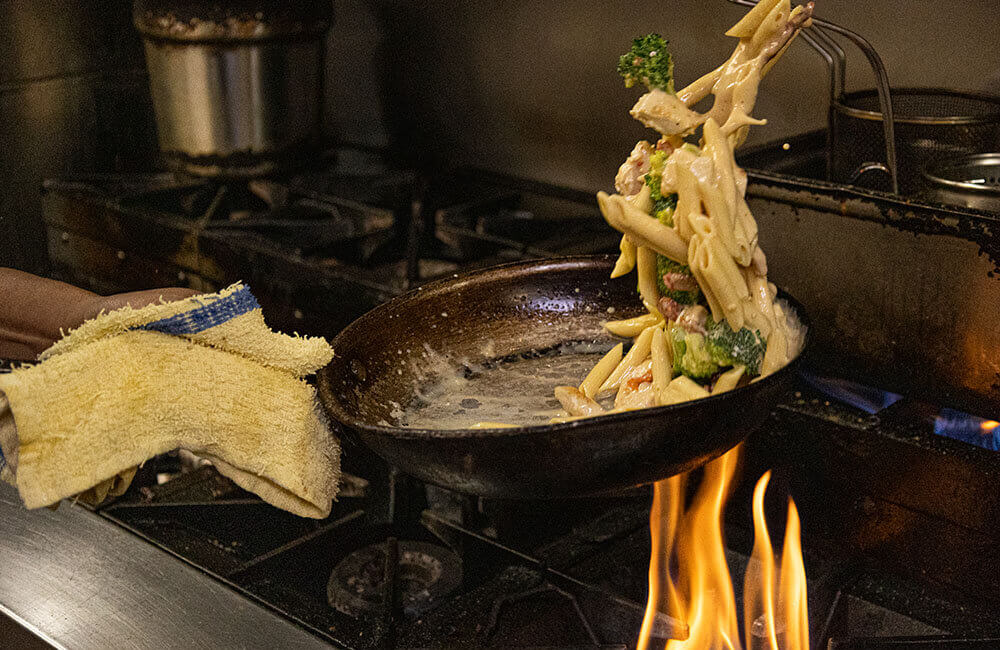 PCG pasta being cooked in the Phoenix City Grille kitchen.