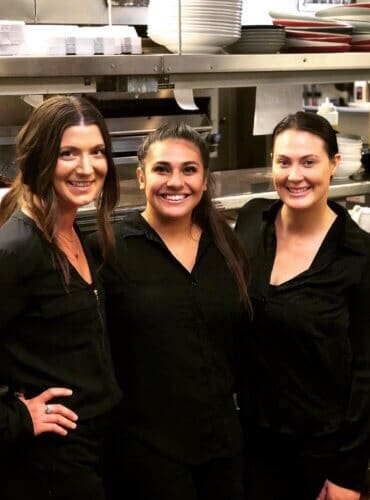 three women in kitchen